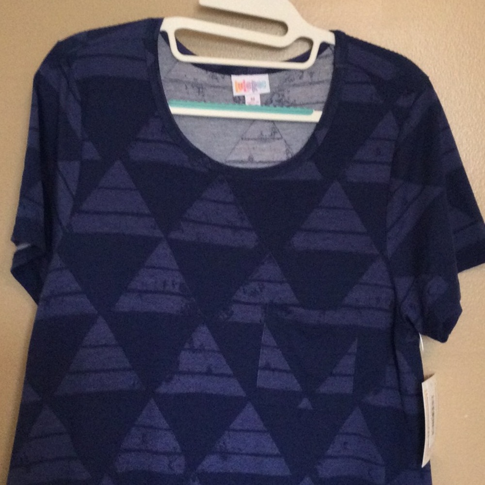 New with tags Lularoe Carly Dress, size Medium. Navy with geometric pattern